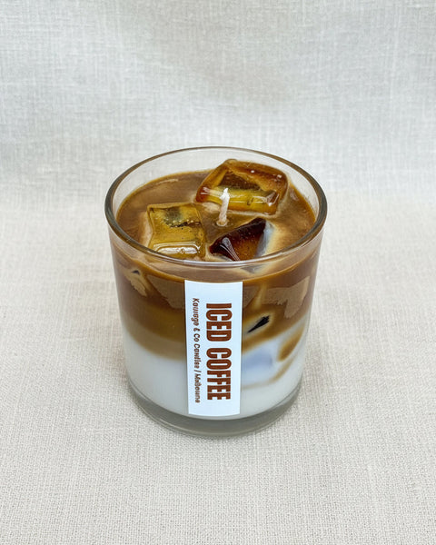 Glass of iced coffee with a label on a burlap background