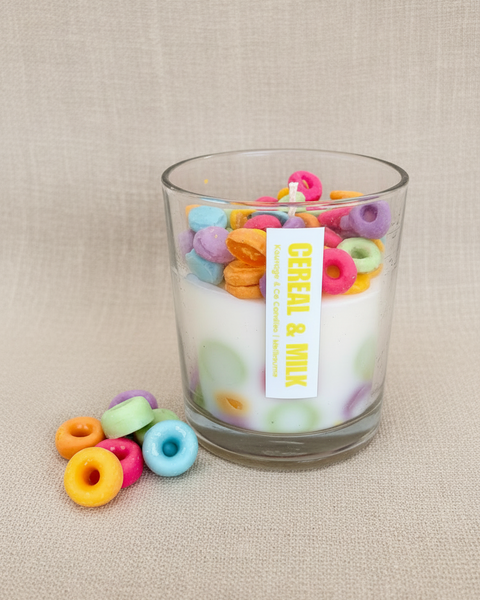 Glass container filled with colorful cereal loops on a beige background